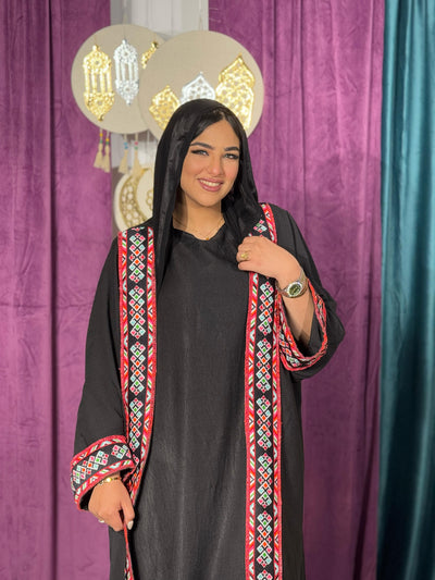 Black kaftan with red embroidered trim